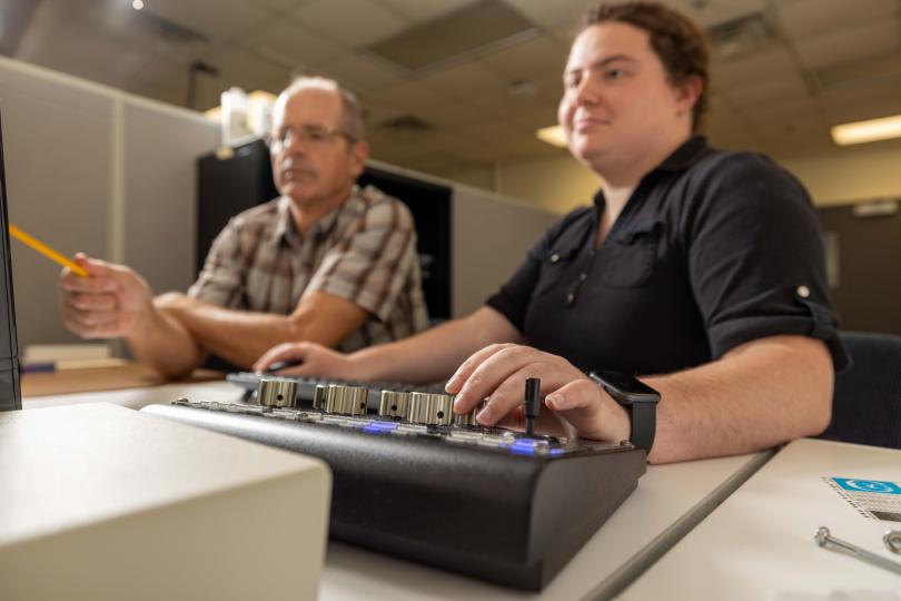 Dave Moecher and Riley Grove at SEM scanning electron microscope