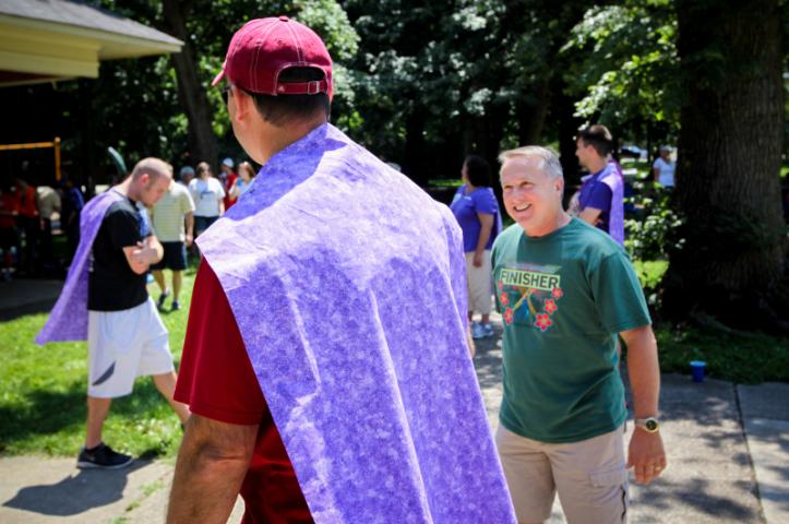 Kelvin talks with the caped crusaders of Team Purple