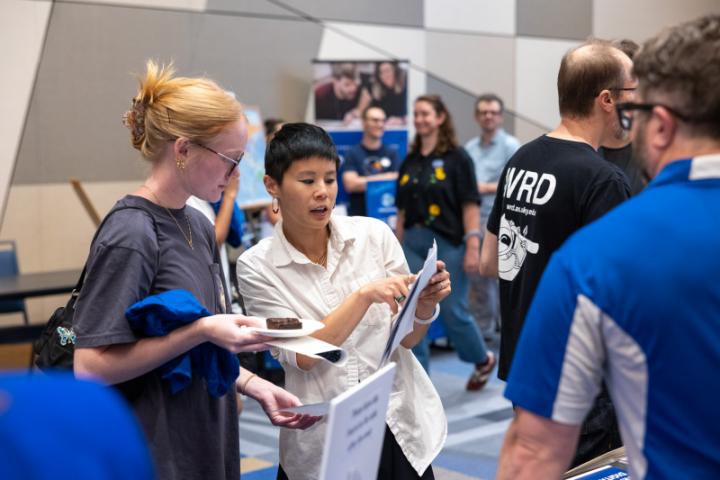 Professor giving instructions to a student