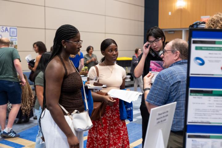 Professor talking to a group of students
