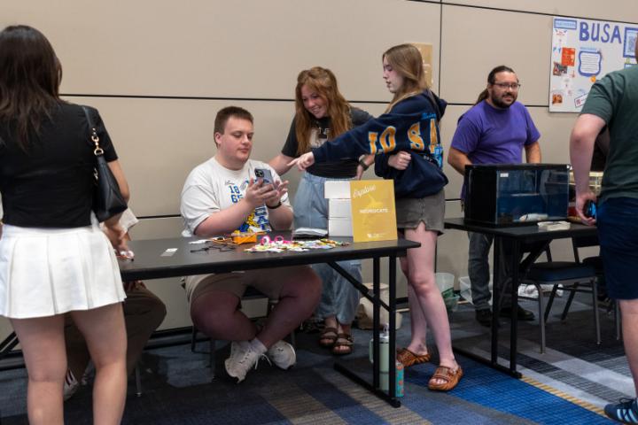 Students at a information table