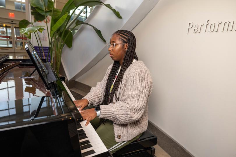 portrait of a student at a piano