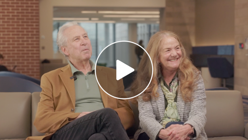 Image screenshot with play button of steve and cindy sullivan